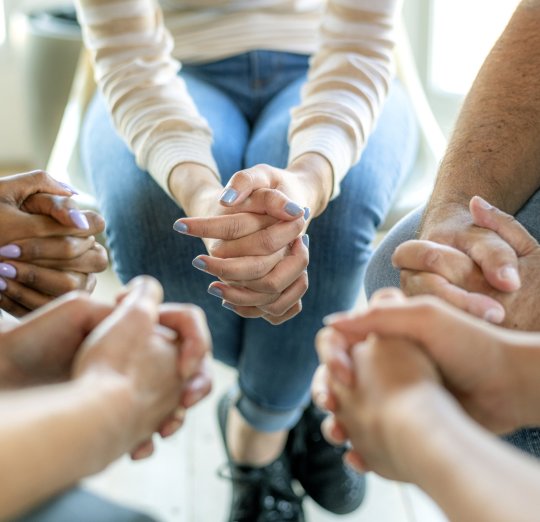 Diverse people in a religious group session